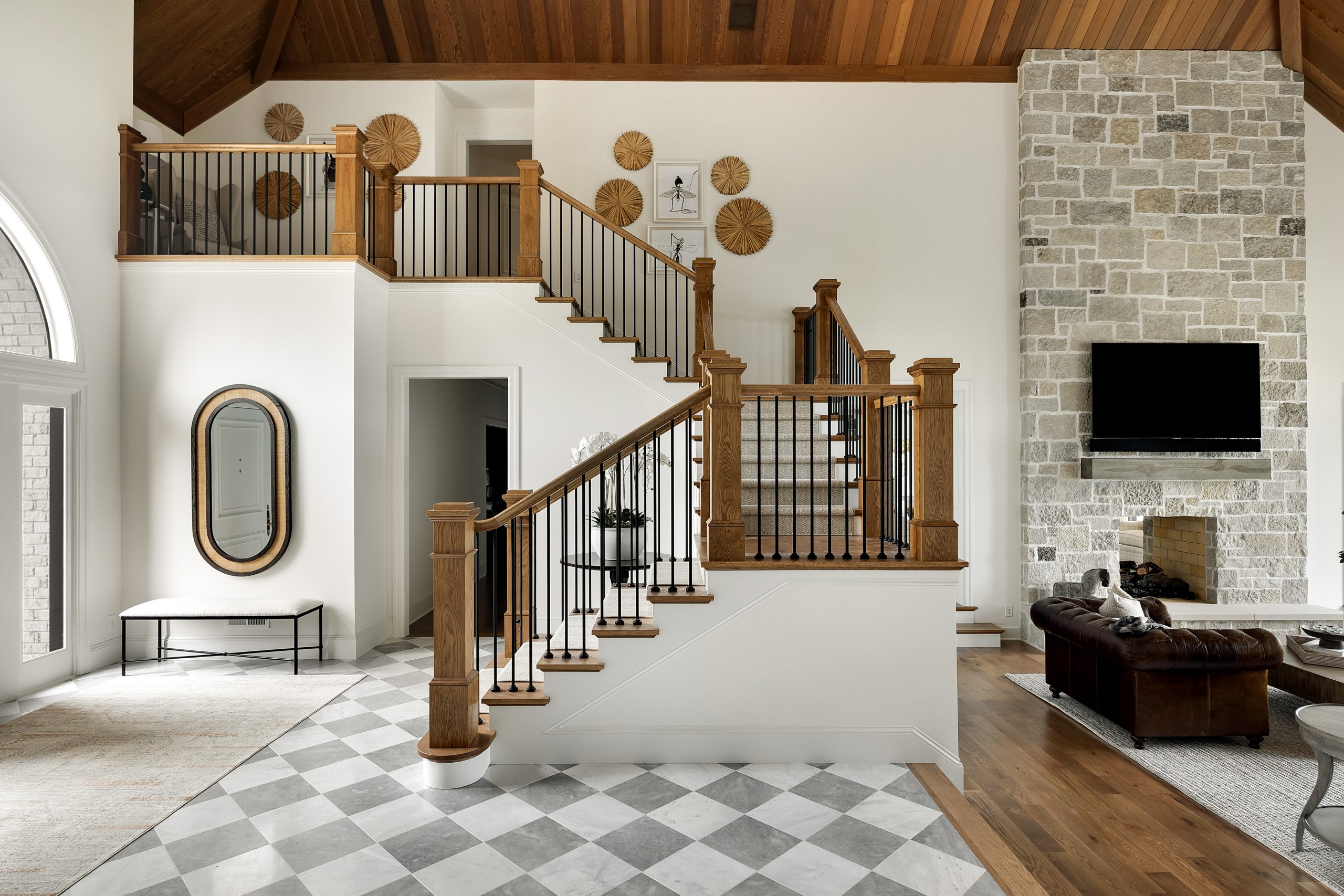 Stunning two-story entry with vaulted wood ceilings and checkerboard flooring