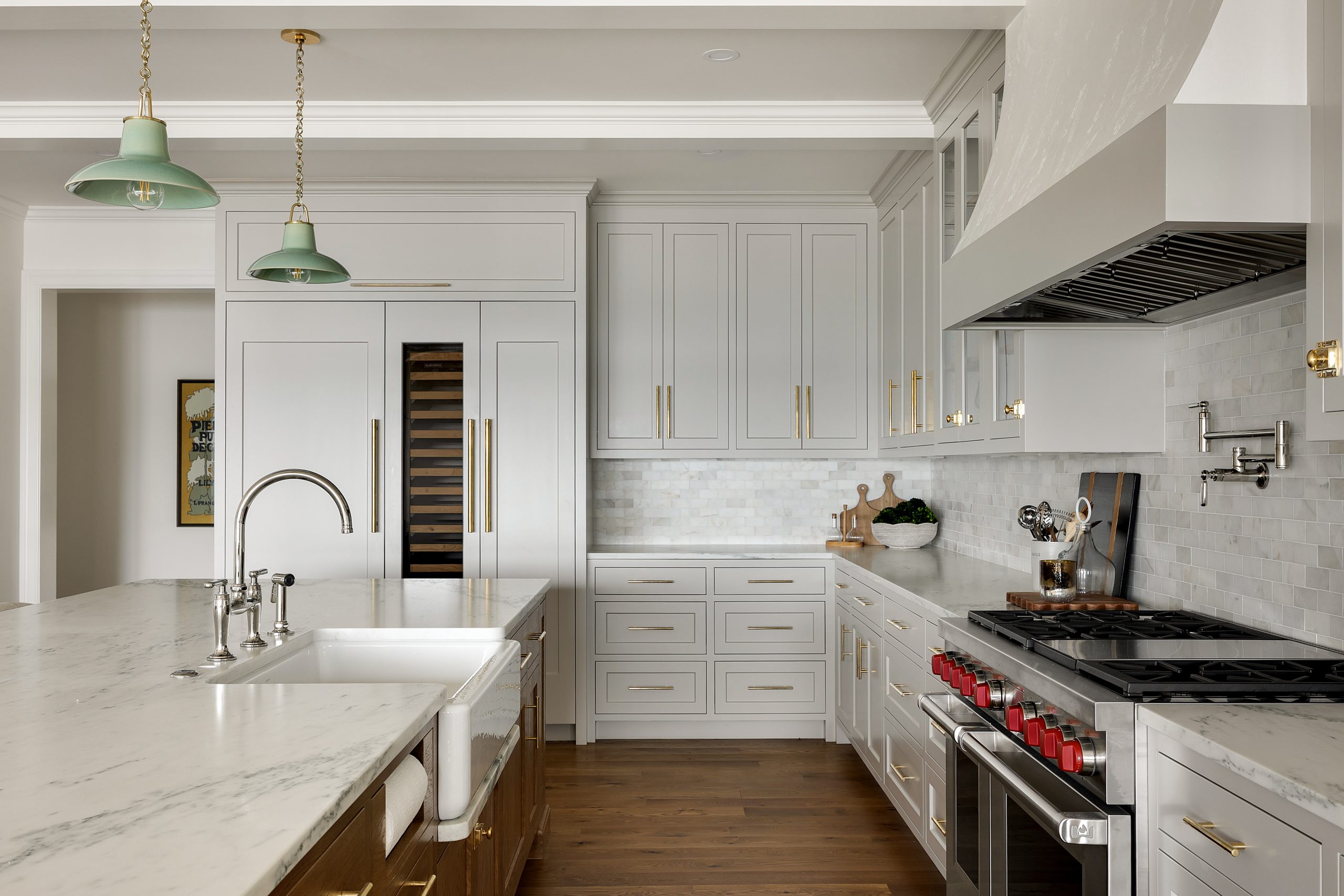 Kitchen with custom cabinetry and marble countertops