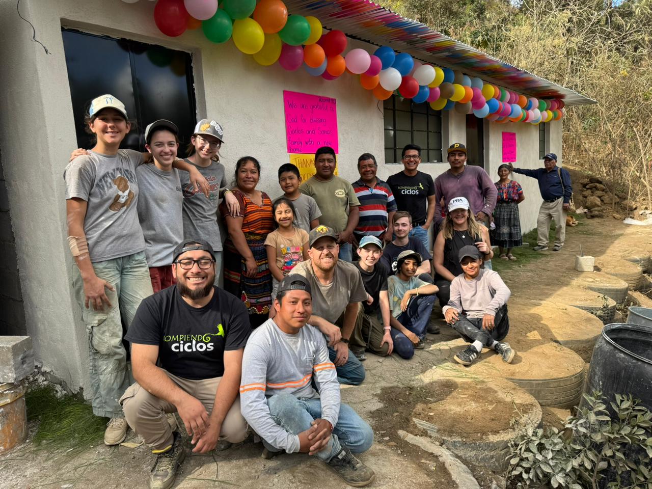 Carlos and Sonia's family outside their home