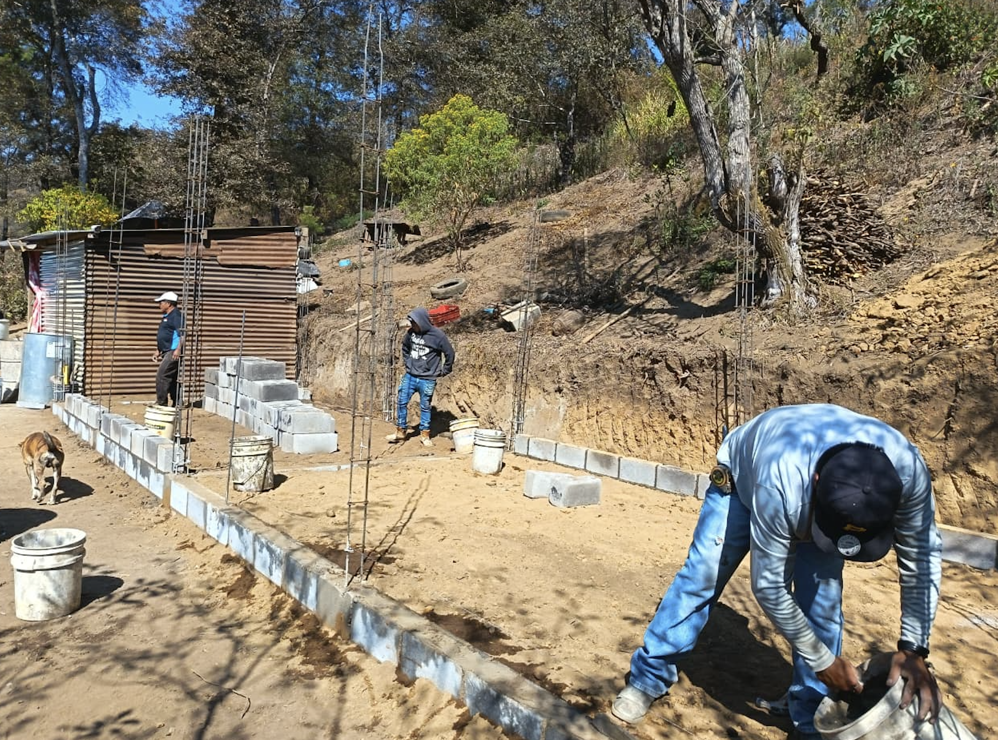 Carlos and Sonia's family in front of their new home